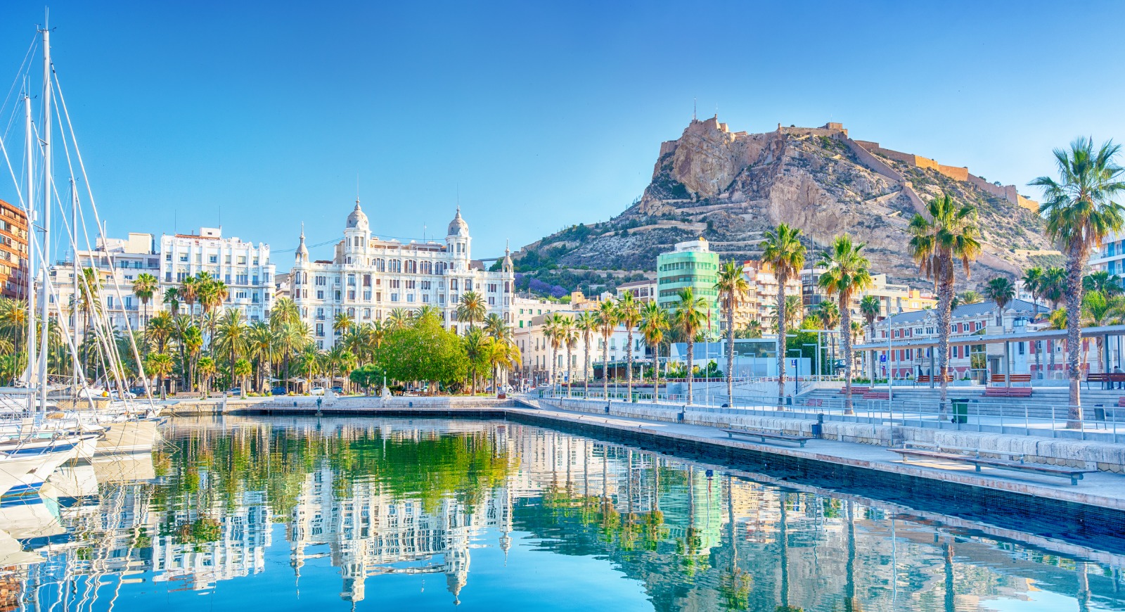 Alicante marina with Santa Barbara Castle on the hill behind – moving from the UK to Alicante