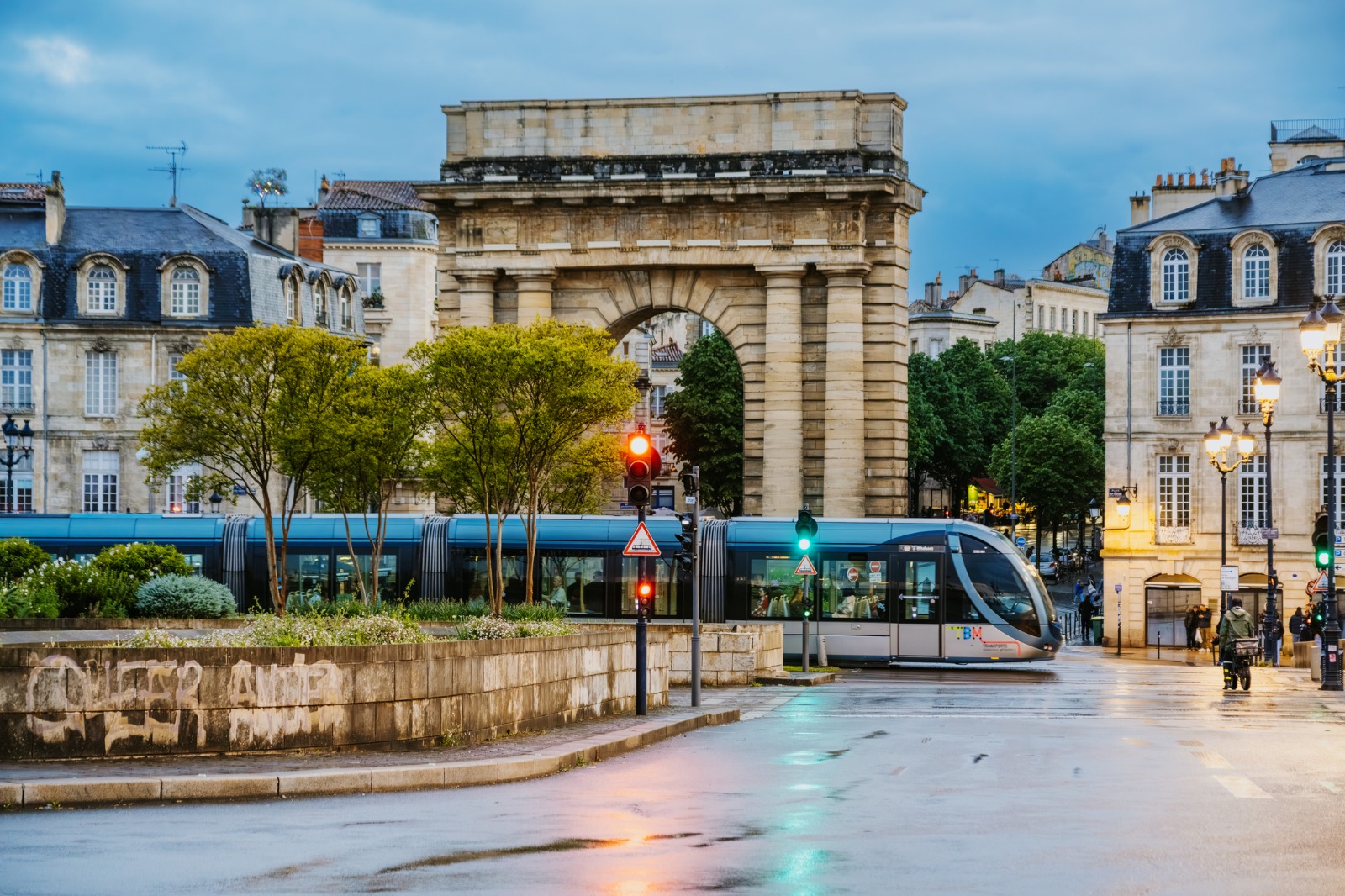 Tram passing the Porte de Bourgogne in Bordeaux – moving from the UK to Bordeaux