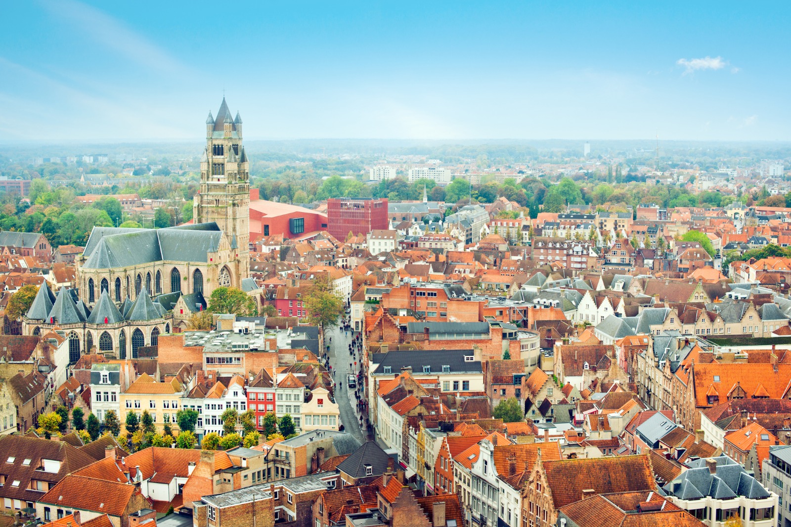 Bruges rooftops with a church tower above the town – part-load removals to Bruges