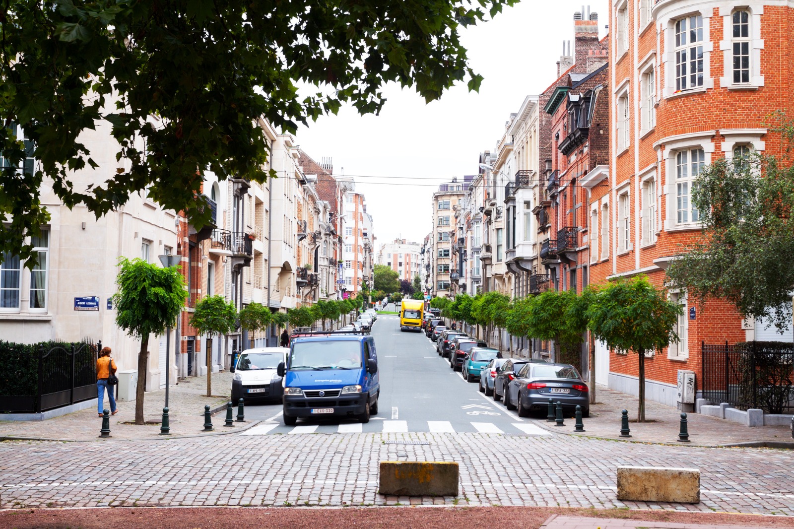 Cobbled residential street lined with townhouses in Brussels – part-load removals to Brussels