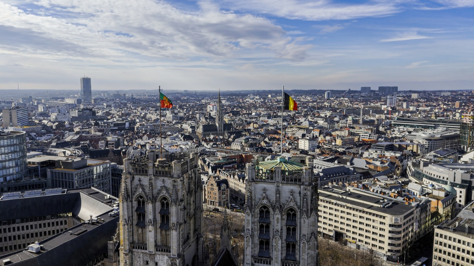 Brussels skyline seen above an ornate rooftop – shared-load removals to Brussels
