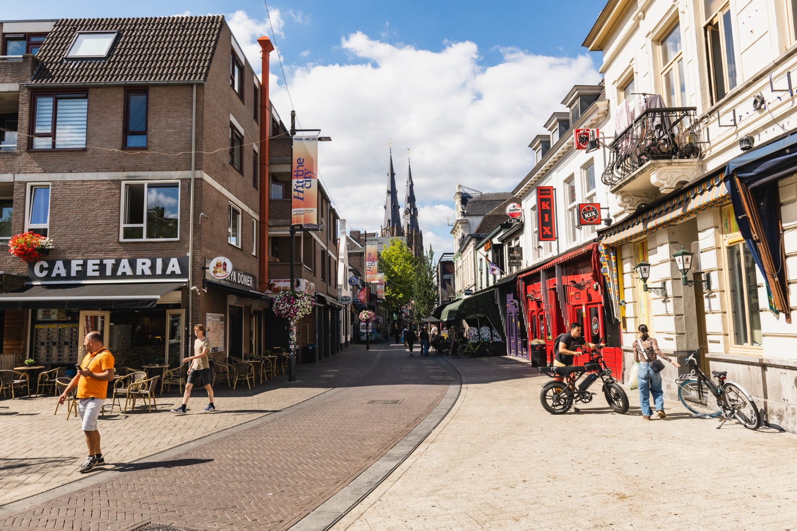 Shops and brick buildings on a pedestrian street in Eindhoven – moving from the UK to Eindhoven