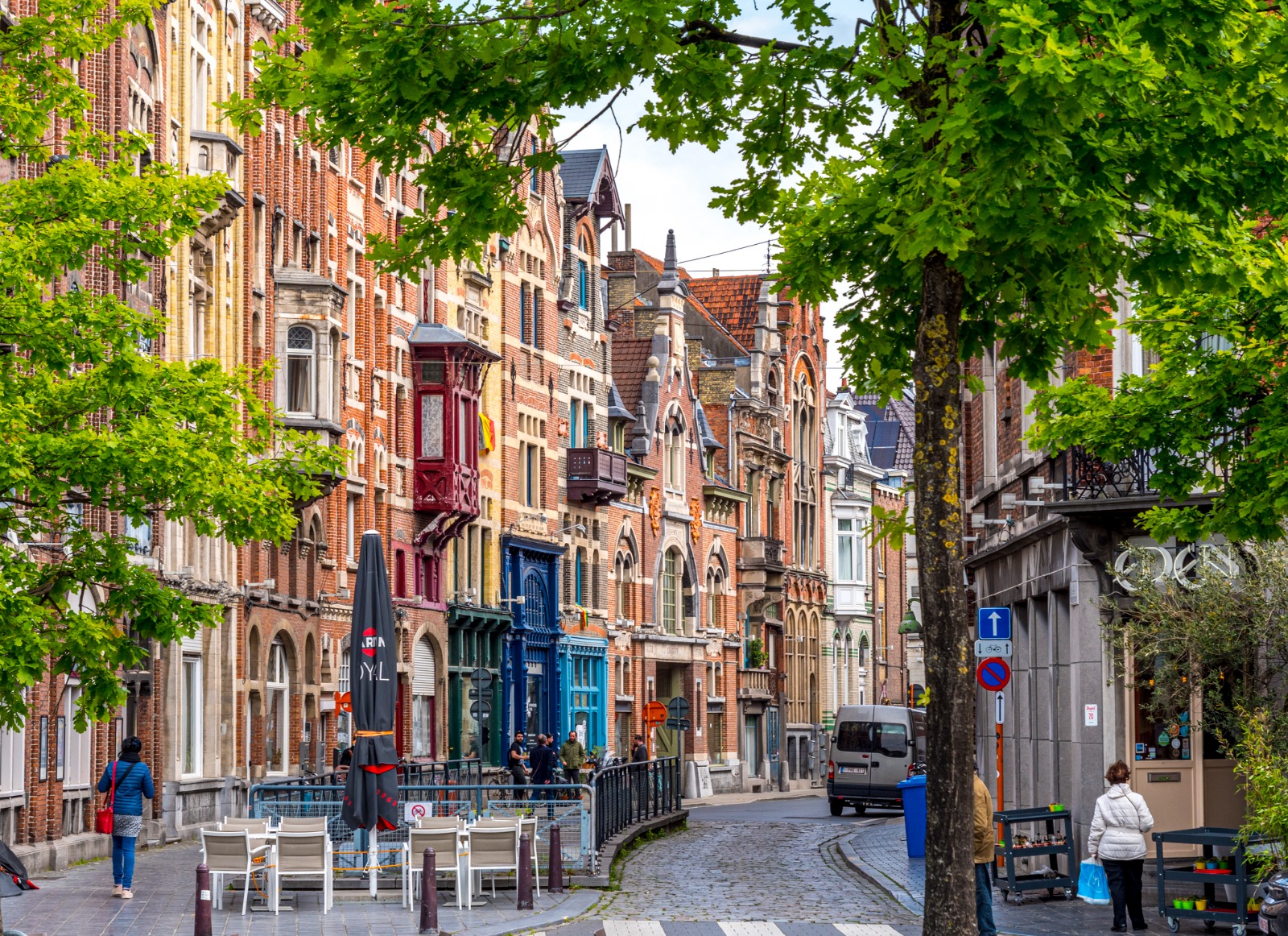 Narrow street between historic brick buildings in Ghent – moving from the UK to Ghent
