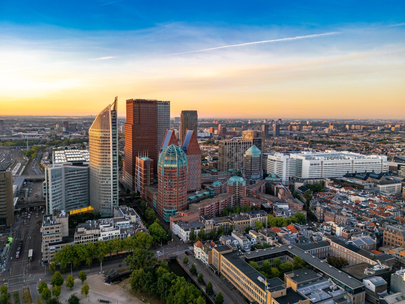 The Hague skyline with modern office towers at sunset – moving from the UK to The Hague
