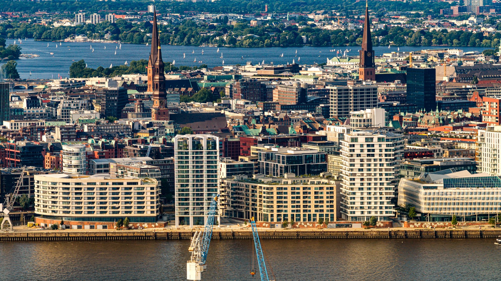 Hamburg waterfront with church spires and residential buildings – moving from the UK to Hamburg