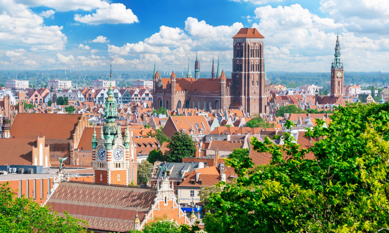 Historic rooftops and church towers in Gdansk, Poland – moving from the UK to Gdańsk