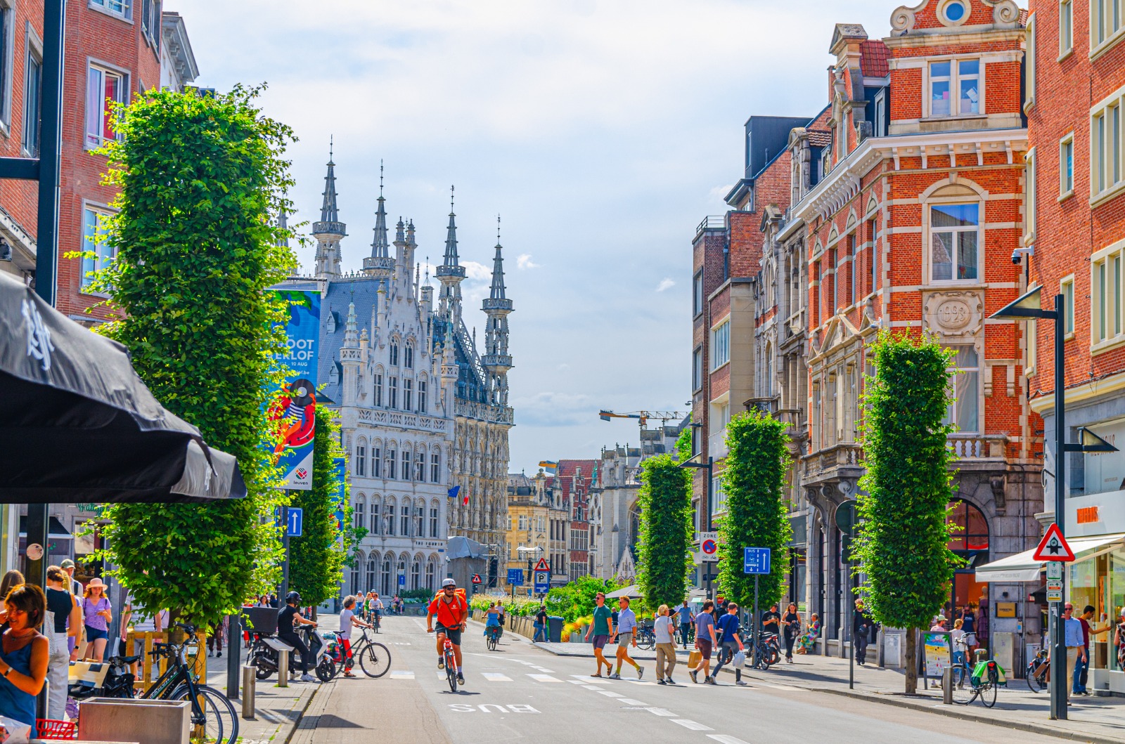 Pedestrian street leading towards Leuven's ornate Town Hall – part-load removals to Leuven
