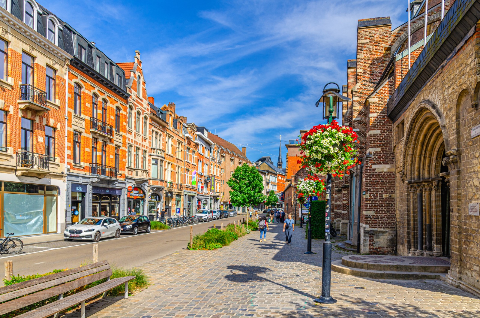 Historic brick buildings beside a cobbled street in Leuven – shared-load removals to Leuven