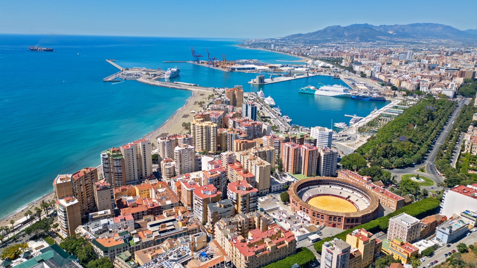 Aerial view of Malaga's harbour, coastline and bullring – removals from the UK to Malaga