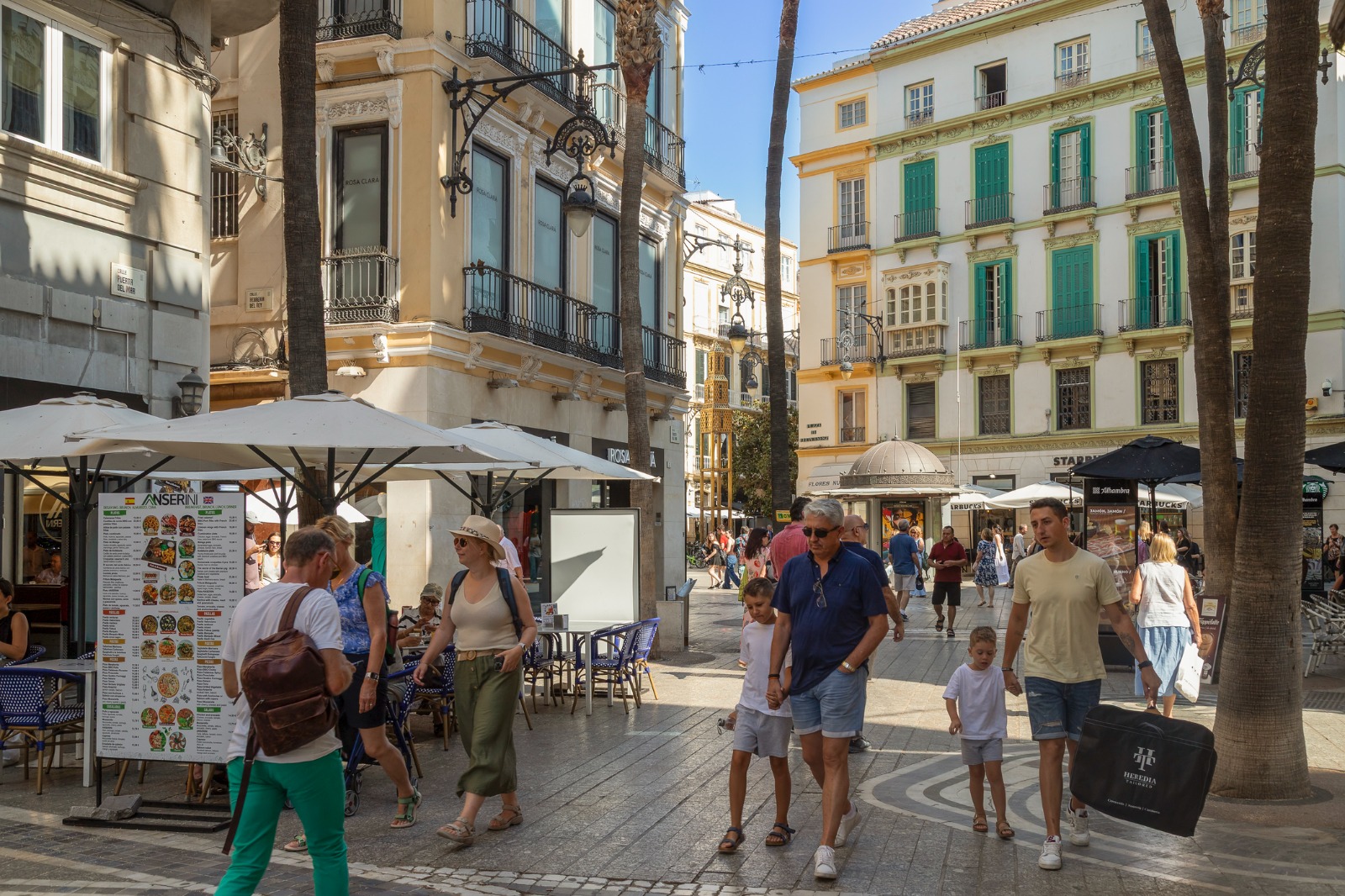 Pedestrians and outdoor cafes in central Malaga – part-load removals to Malaga