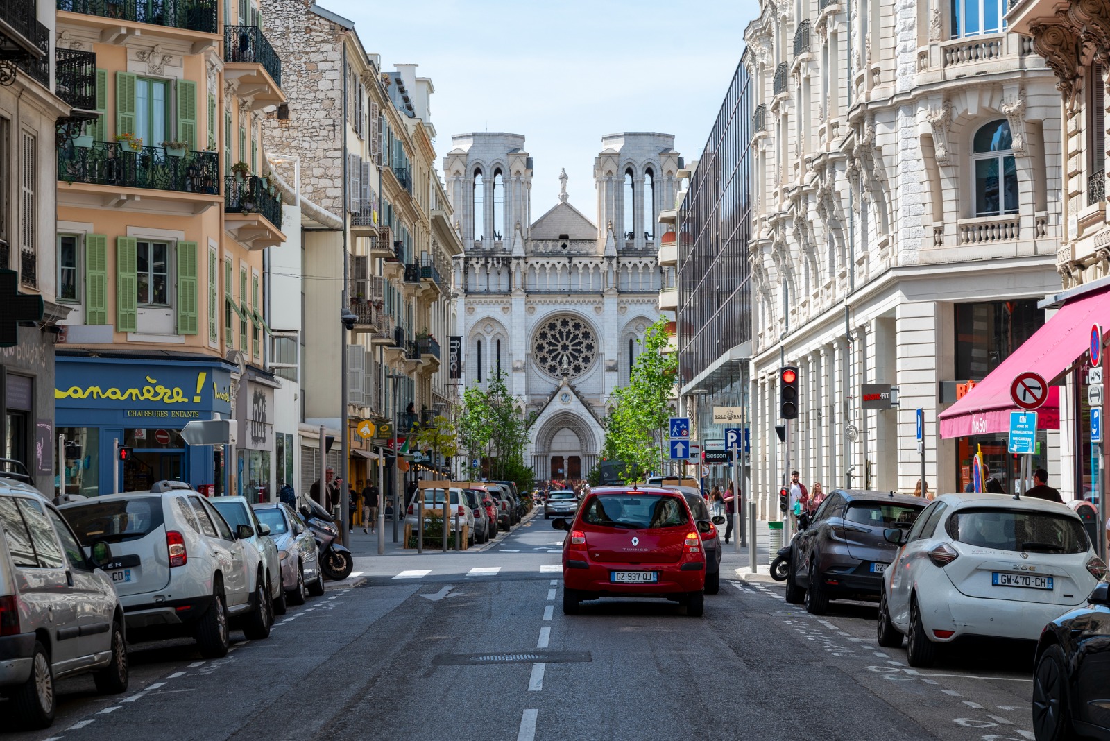 Street leading towards a church facade in Nice – shared-load removals to Nice