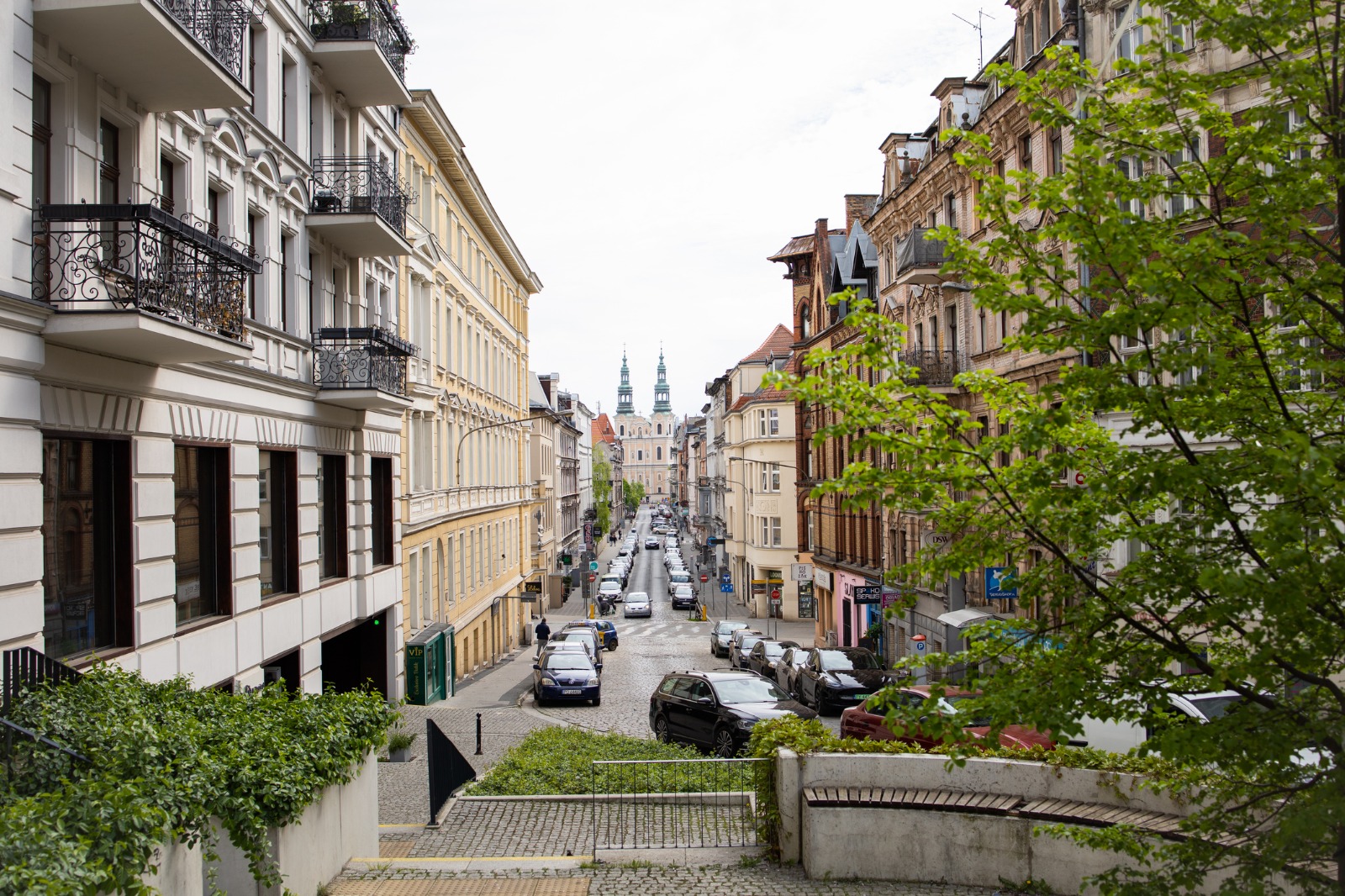 Residential street lined with historic townhouses in Poland – moving from the UK to Poland