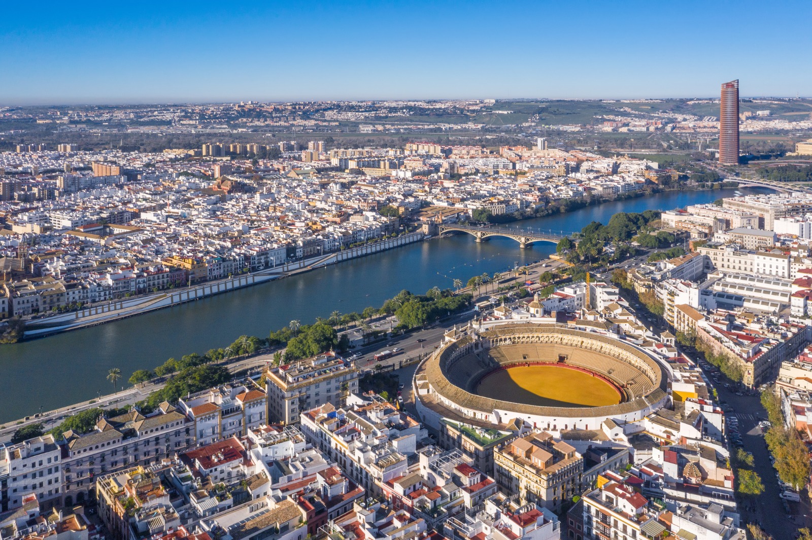 Seville's river, bridges and bullring seen from above – shared-load removals to Seville