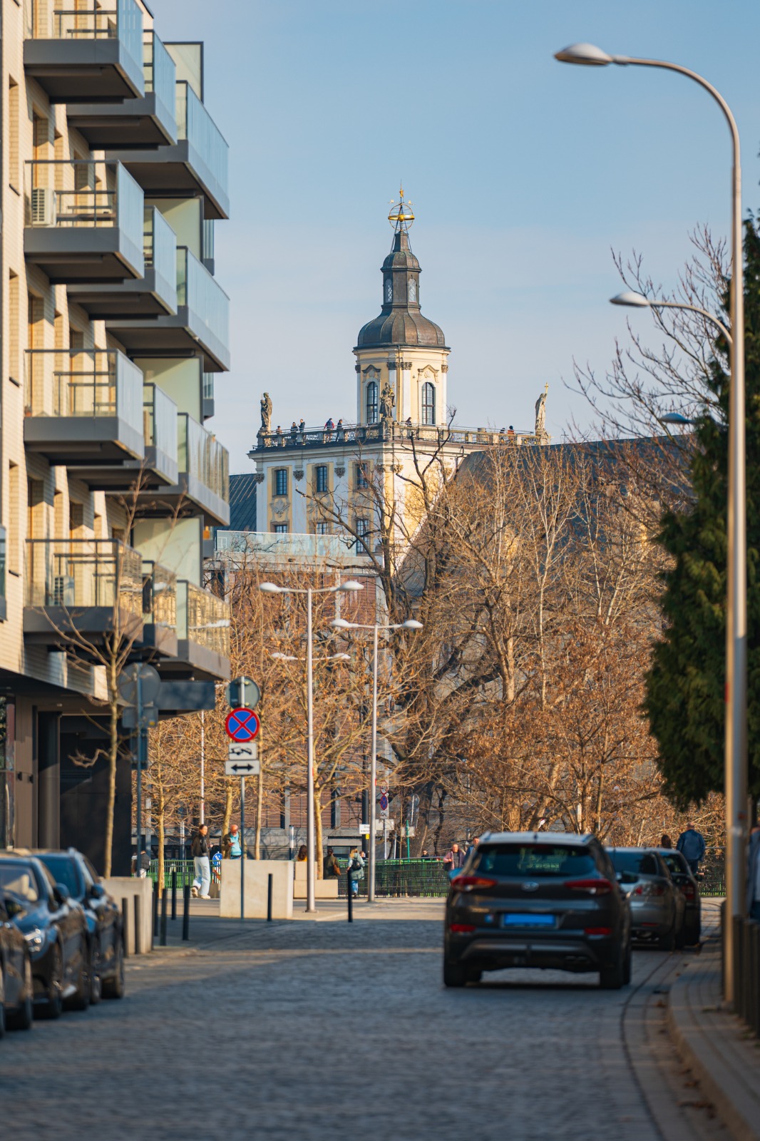 Residential street leading towards a church tower in Wroclaw – moving from the UK to Wrocław