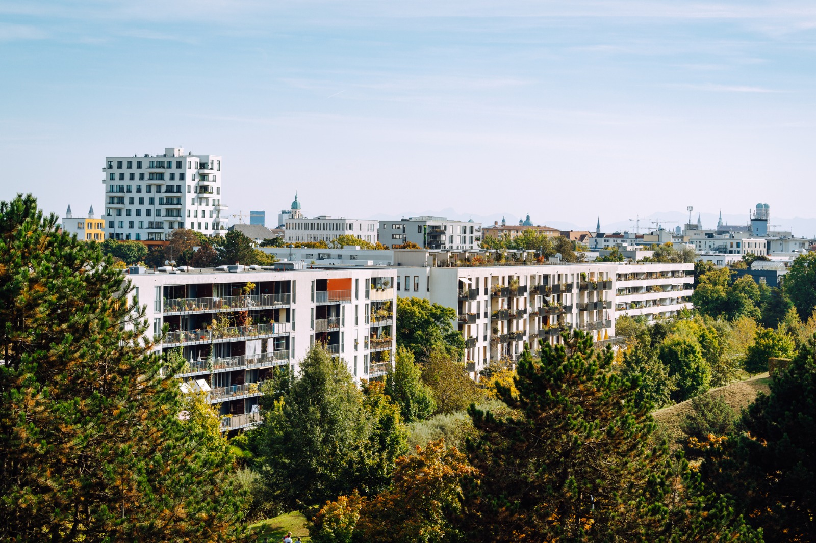 Modern apartment buildings among trees in Munich, Germany – shared-load removals to Munich