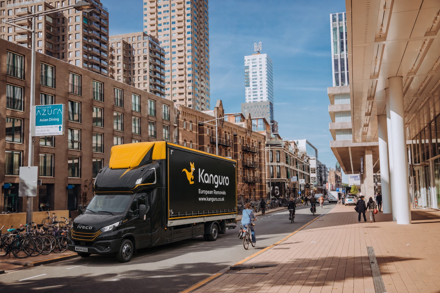 Kanguro removal van beside modern city apartments in the Netherlands – shared-load removals from the UK to the Netherlands