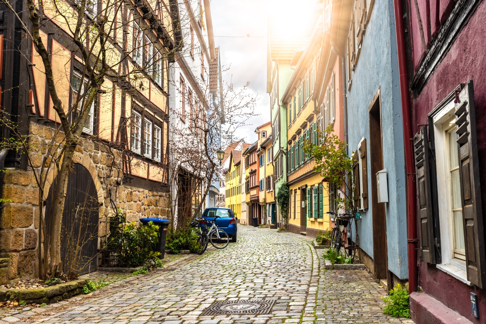 Narrow cobbled street between timber-framed buildings in Germany – removals from the UK to Germany