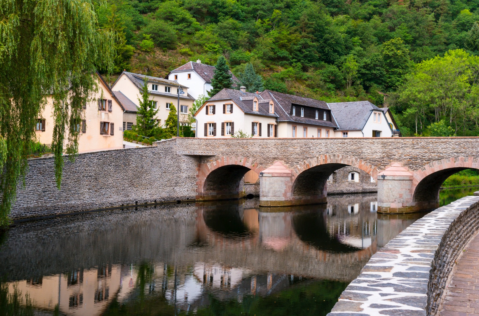Stone bridge and riverside houses in Luxembourg – shared-load removals to Luxembourg