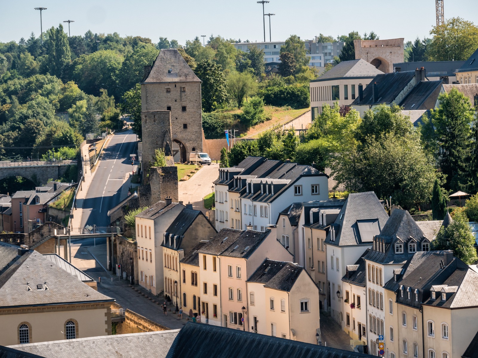 Historic stone tower above houses in Luxembourg City – removals from the UK to Luxembourg