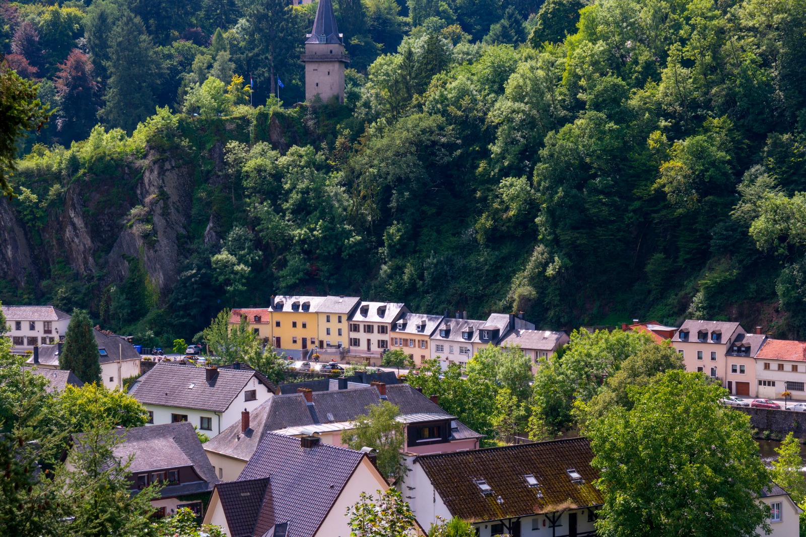 Village houses beneath a wooded hillside in Luxembourg – part-load removals to Luxembourg