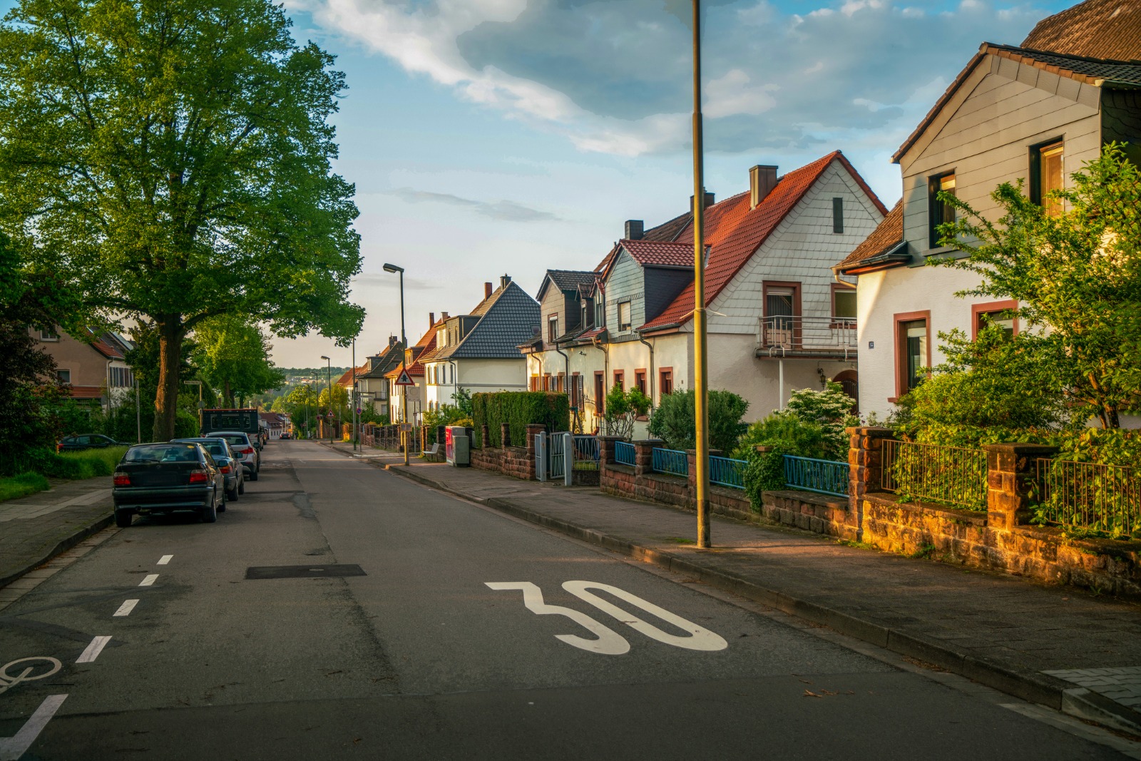 Residential street with houses and a 30 km/h road marking in Luxembourg – removals from the UK to Luxembourg