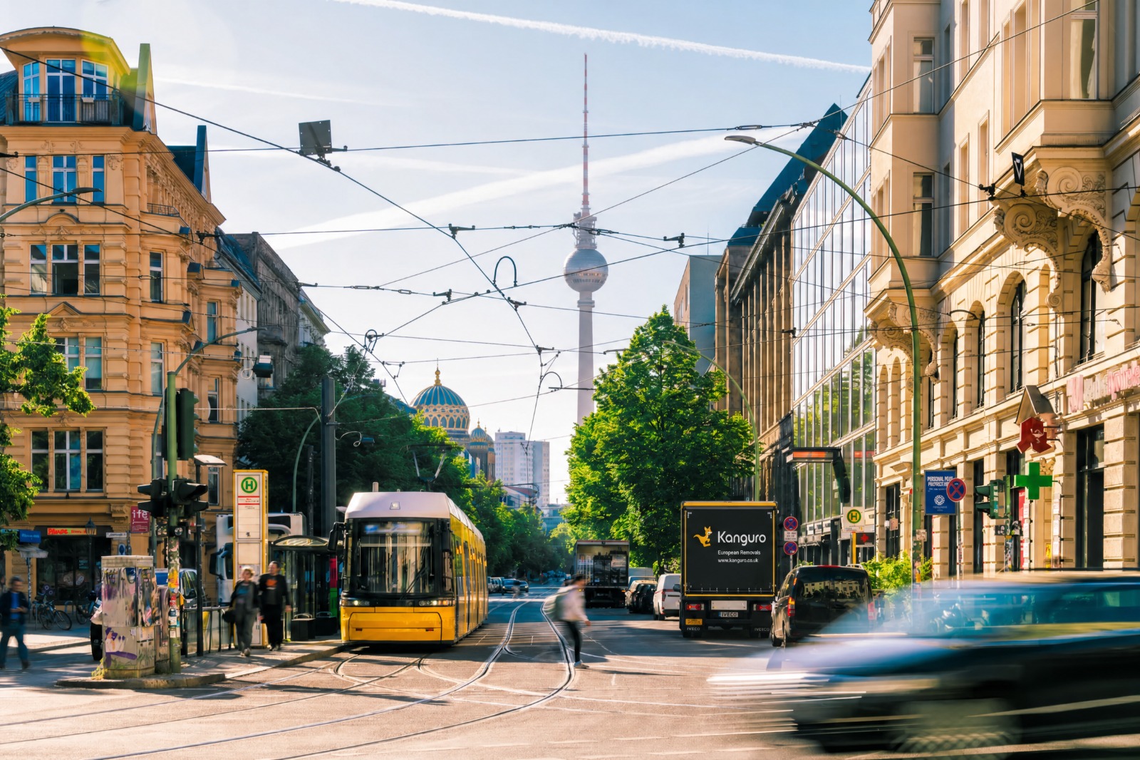 Kanguro removal truck beside a tram in Berlin – moving from the UK to Berlin