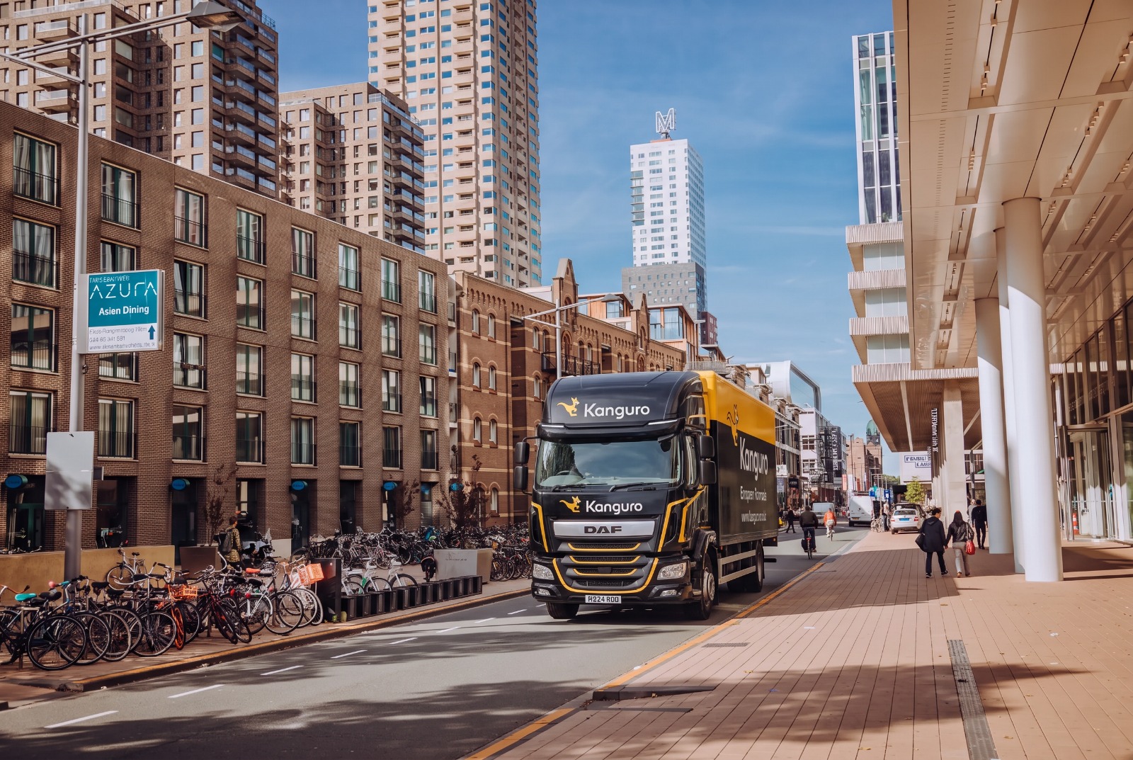 Kanguro removal truck beside modern apartment buildings in the Netherlands – removals from the UK to the Netherlands